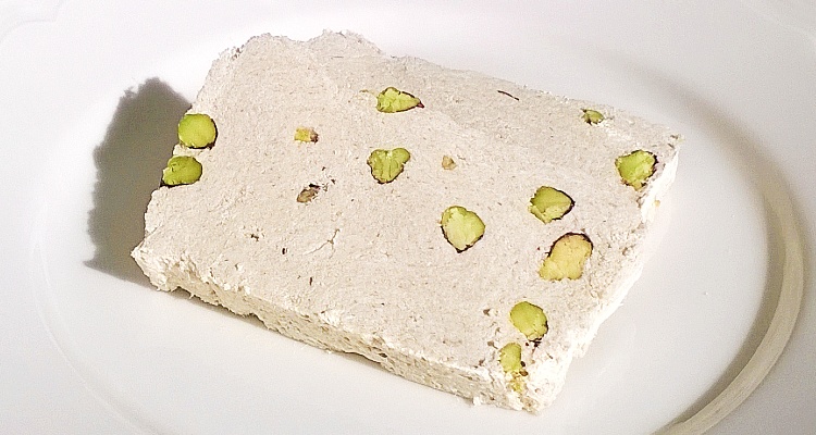 Two slices of Argoudelis halva with Kernel pistachio